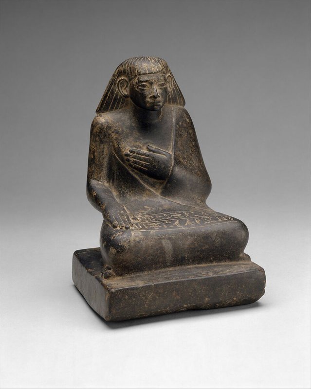 Source photo: a seated Egyptian statuette on a neutral gray background
